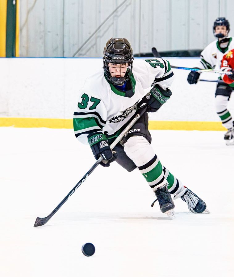 Bella skating with the puck